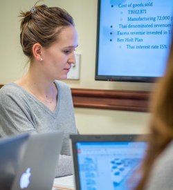 School of Business student working on laptop