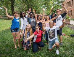 Group of students at Orientation smiling at the camera.