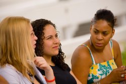 Photo of three female students on campus.