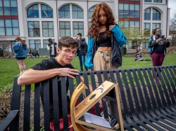 Physics major Louis Araujo adjust a "sunspotter," which projects the Sun's image and allows a safe viewing of the eclipse.
