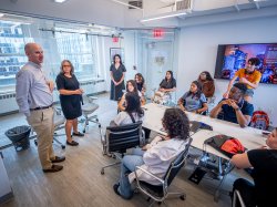 students gathered in a meeting room