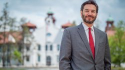 Photo of Montclair State University president Jonathan G.S. Koppell in front of College Hall
