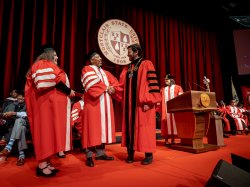 president koppell shaking hands on stage