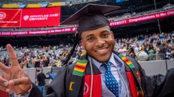 Graduate at commencement in cap and gown