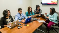 green team brainstorming in conference room