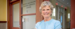 Photo of Ellyn McColgan outside the Ellyn A. McColgan Student Services Center.