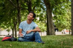 Photo of young man on lawn
