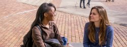 Photo of two students talking