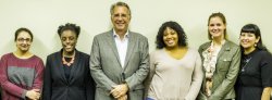 Photo of an alumnus and five students in the humanities or social sciences.