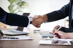 Picture of two business people shaking hands