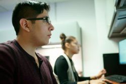 student at computer terminal in research lab
