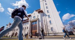 Students walking on campus in front of University Hall.