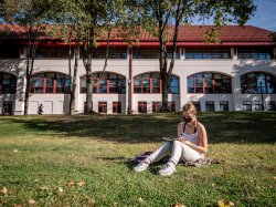 Student sitting on the grass