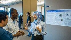 student discussing poster