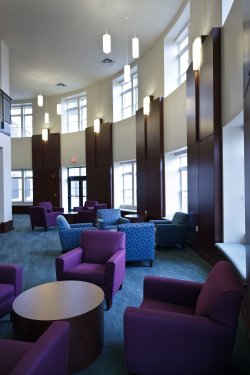 The lounge in Machuga Heights featuring some very colorful, comfortable chairs and table spaces.