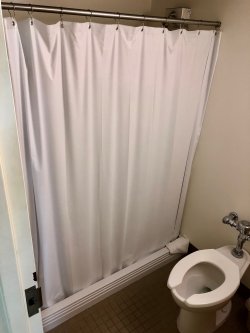 The bathroom in a Single Room in Blanton Hall with a shower.