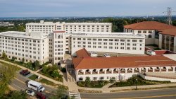 The exterior of Machuga Heights and Sam's place from an aerial view.