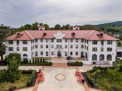 The exterior of Russ Hall from an aerial view showing the full-length of the building.