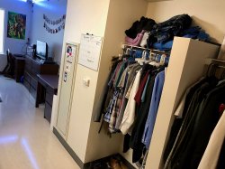 The closet space in a bedroom at a Double Unit in the Heights