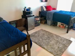 Two beds on either side of a room in a Double Room in the Heights.