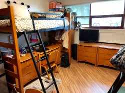A Triple Unit in Stone Hall showcasing another angle of the bunk bed with the desk underneath the top bunk.