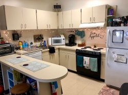 The kitchen in a Single Apartment in the Village Apartments.