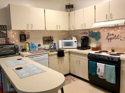 The kitchen in a Single Apartment in the Village Apartments.
