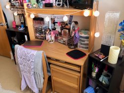 A desk in a bedroom in a Single Apartment in the Village Apartments.