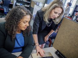 women working on a laptop
