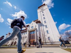 Student walking toward University Hall