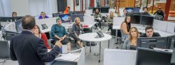 School of Communication and Media - News Lab - Students following Professor Effron