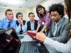 students discussing with advisor