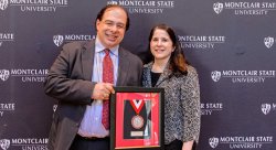 Scriffignano holding his Distinguished Alum Award