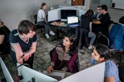 students getting feedback from professor in computational linguistics class
