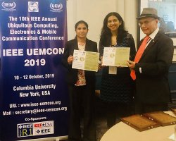 receiving best paper award certificates at UEMCON 2019