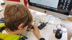 student working with Arduino device