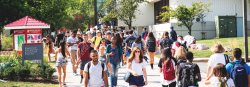 Large group of students walking by the Student Center