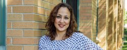 Photo of Nydia Monagas taken outside Dickson Hall.