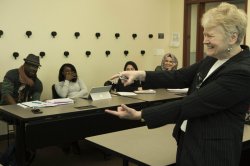 Image of a sociology faculty member teaching in a classroom.