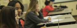 Image of students in a small seminar room.