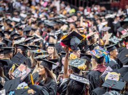 photo of students at graduation in cap ans gowns