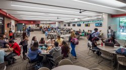 Inside of the Student Center cafeteria with students sitting at the tables
