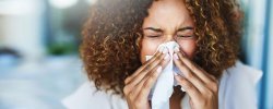 woman sneezing