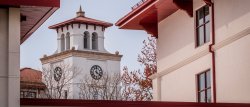 view of the bell tower between buildings