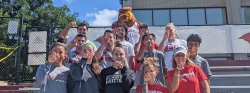 photo of athletes and rocky doing the hawk