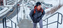 Image of student climbing stairs by CarParc in the snow