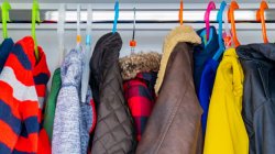 winter coats hanging on a rack