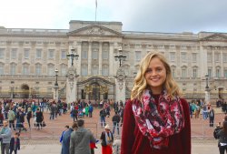 Student posing for portrait outside Buckingham palace