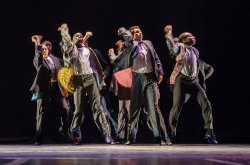 men dancing in suits