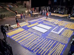 Students preparing a theatre set for construction